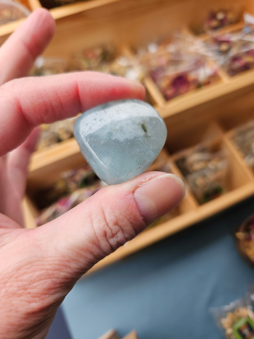 Hand holding Aquamarine A Grade to show quality and size