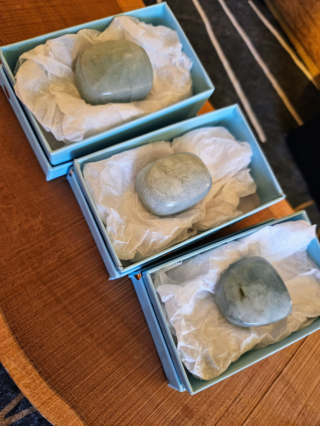 Three Aquamarine stones in boxes