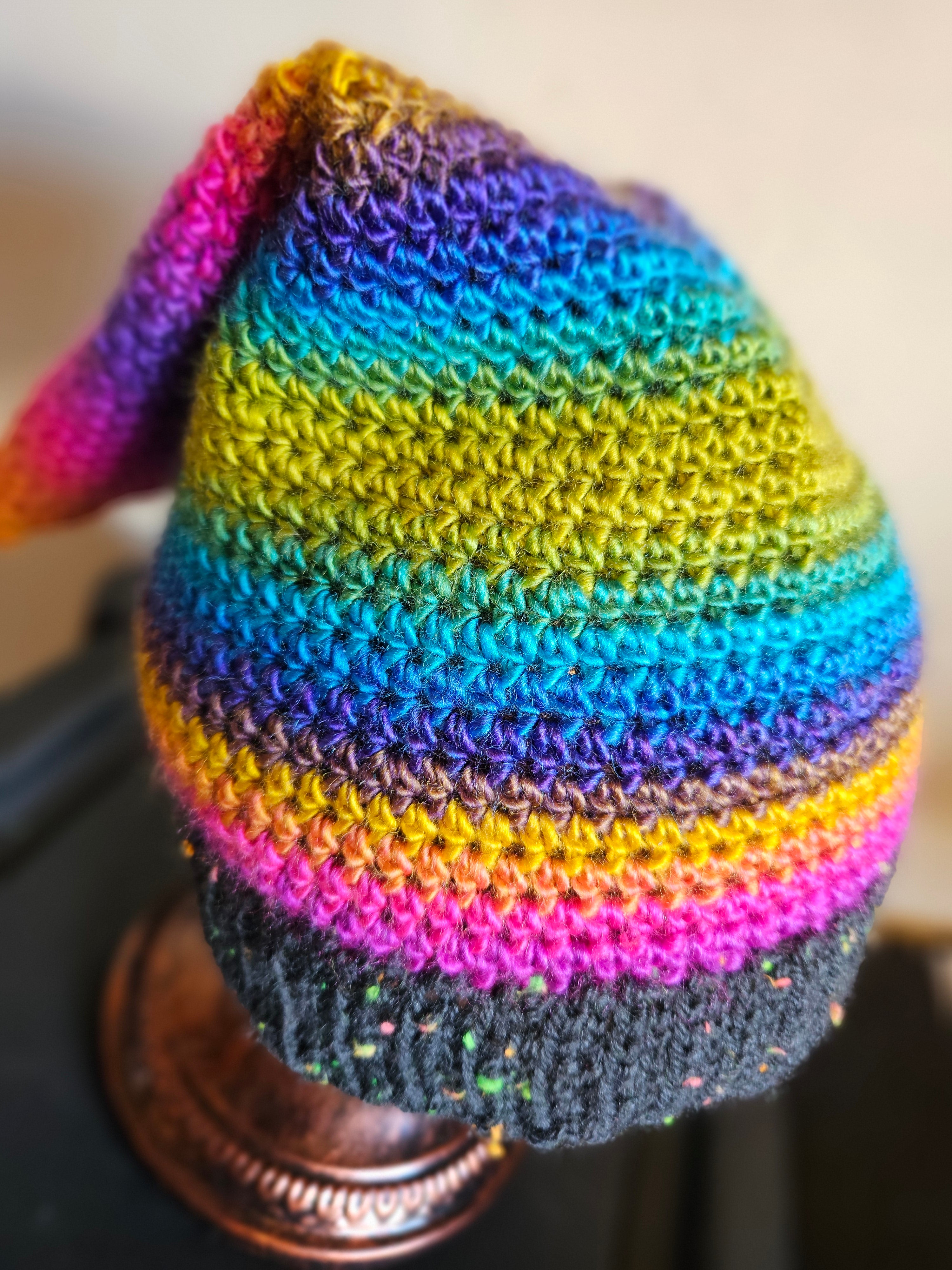 Colorful striped beanie on a blurred background