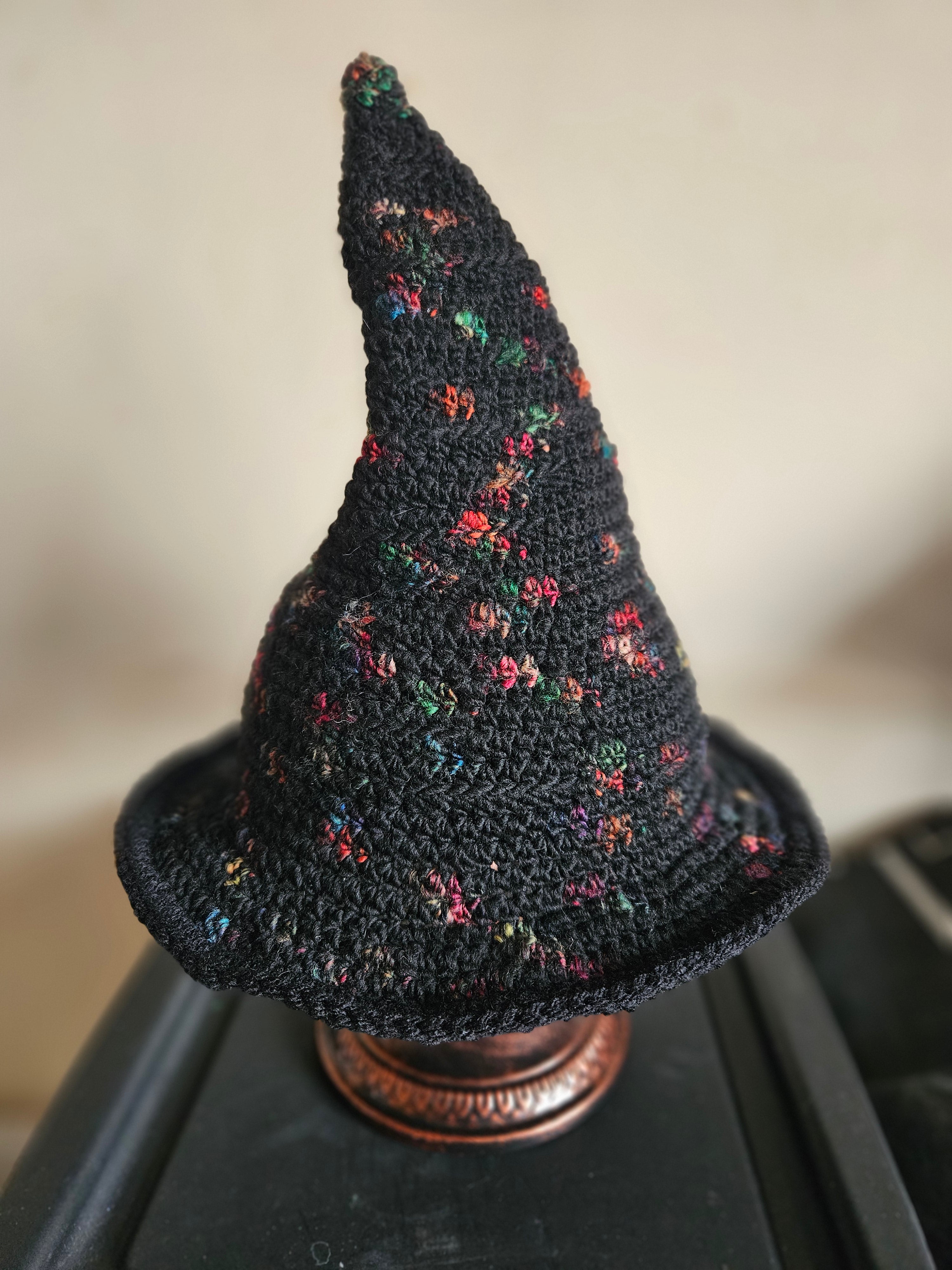 Black crochet witch hat with flower pattern