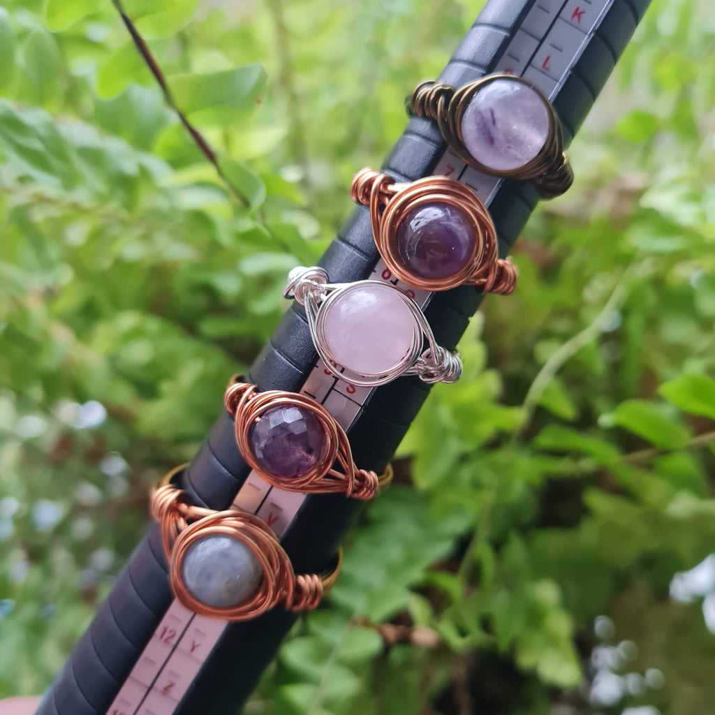 Gemstone rings on a ring sizer