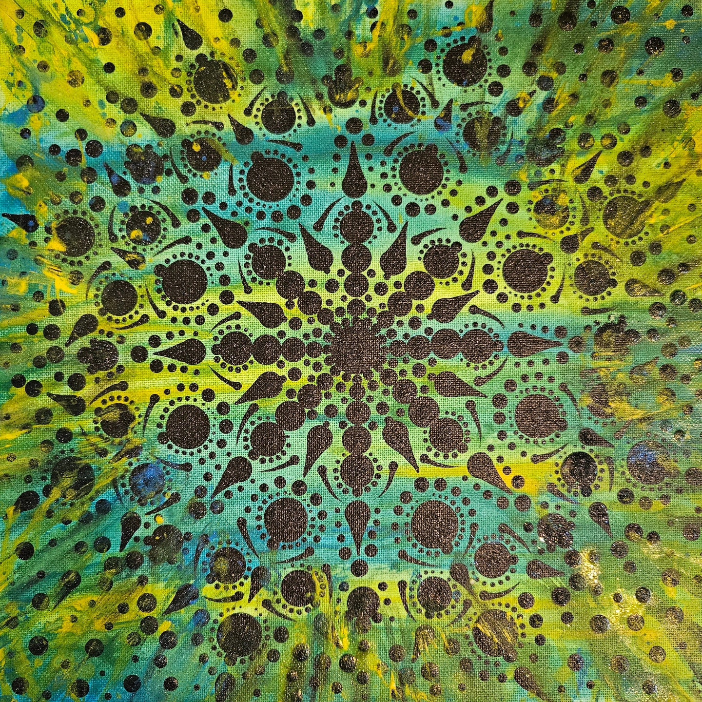 Black mandala pattern on a green background