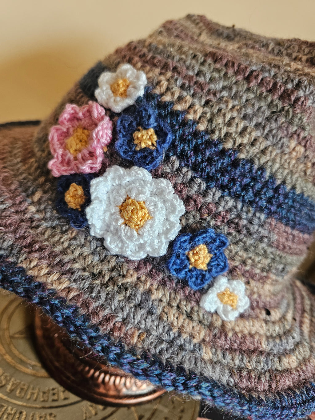 Close up of hat with crocheted flowers