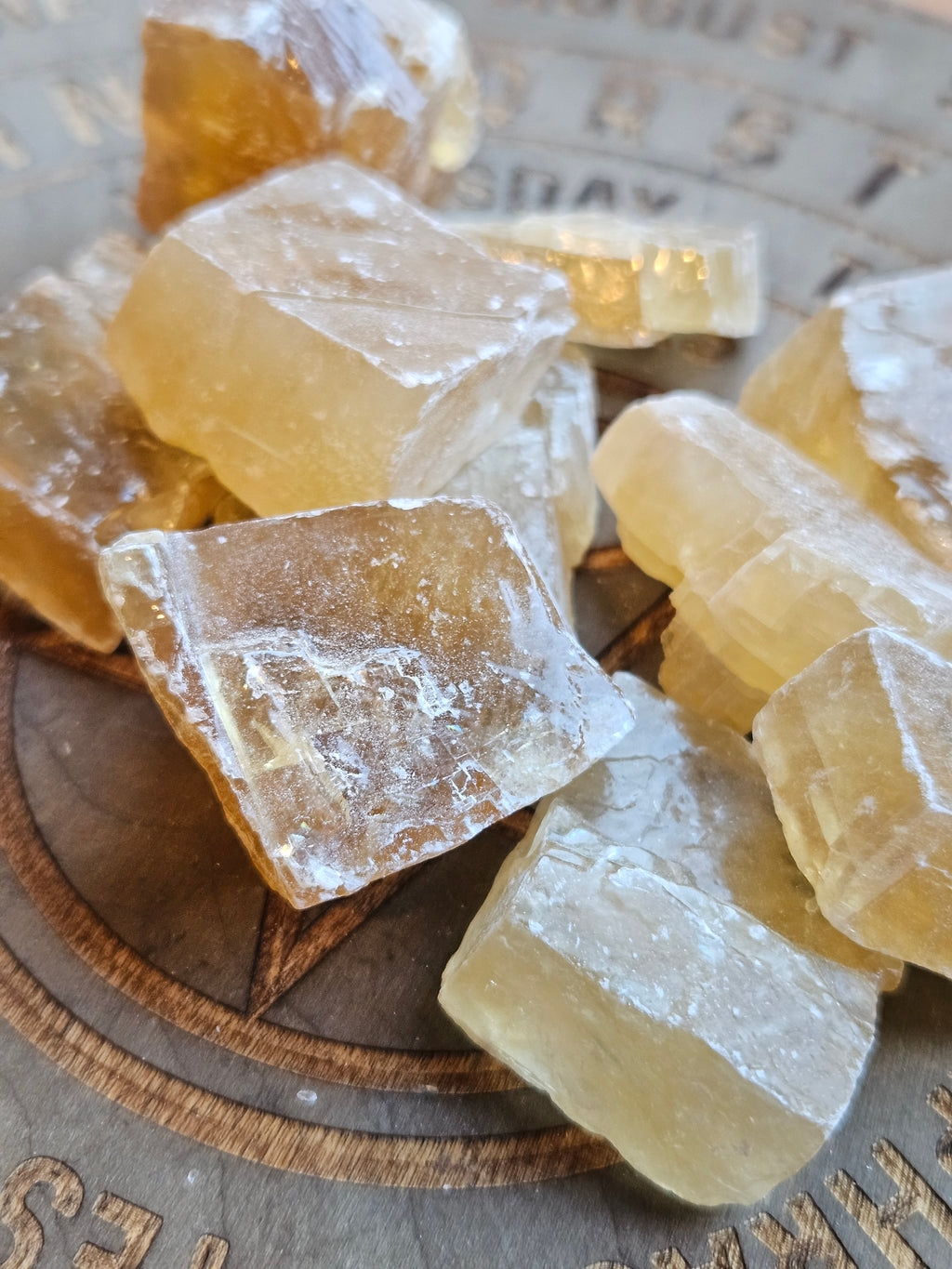 Citrine Calcite chunks on a wooden board