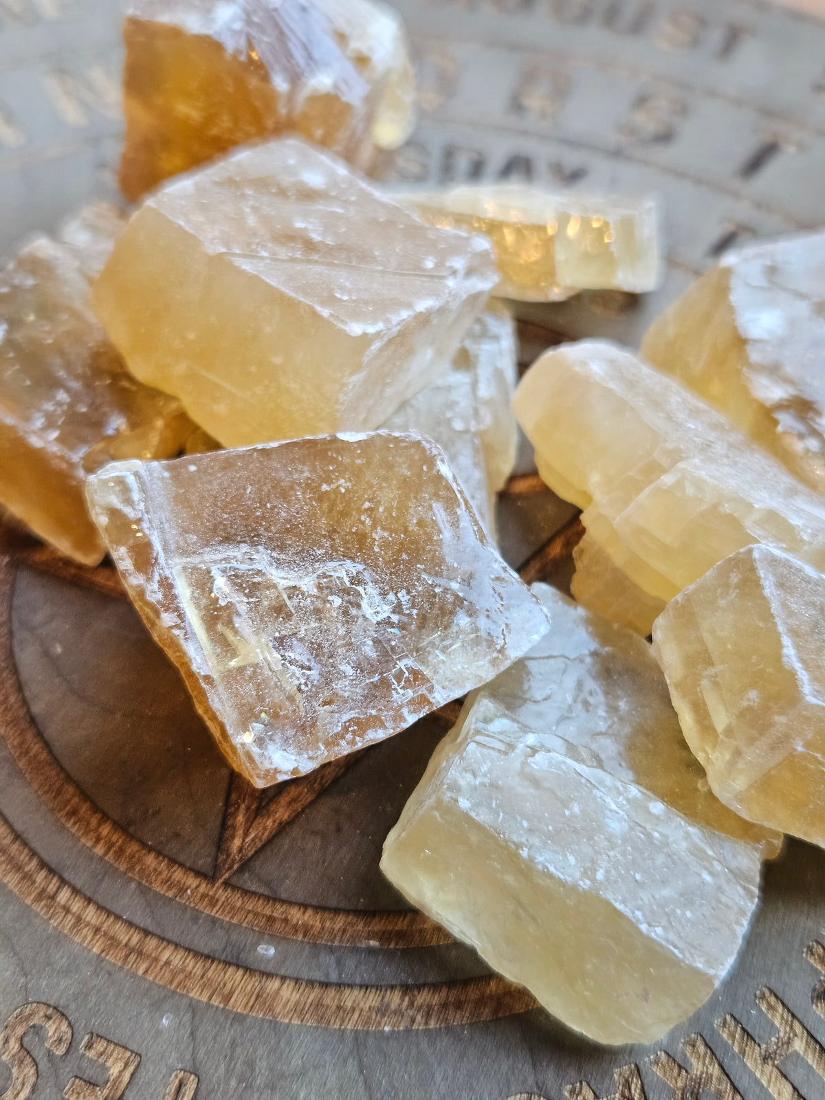 Citrine Calcite chunks on a wooden board