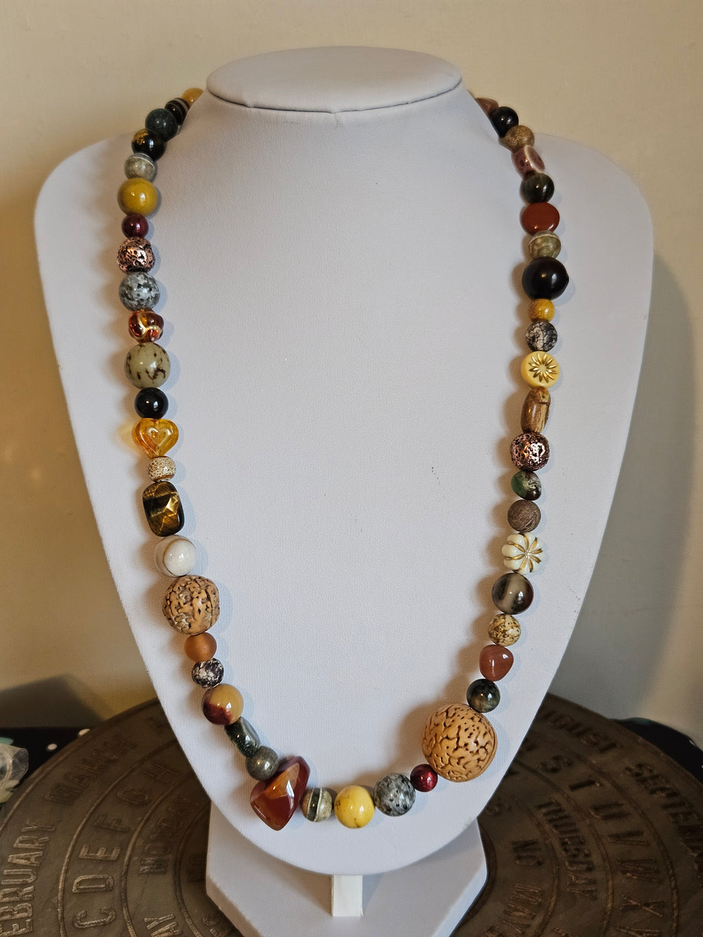 Necklace with multicolored beads on a mannequin bust