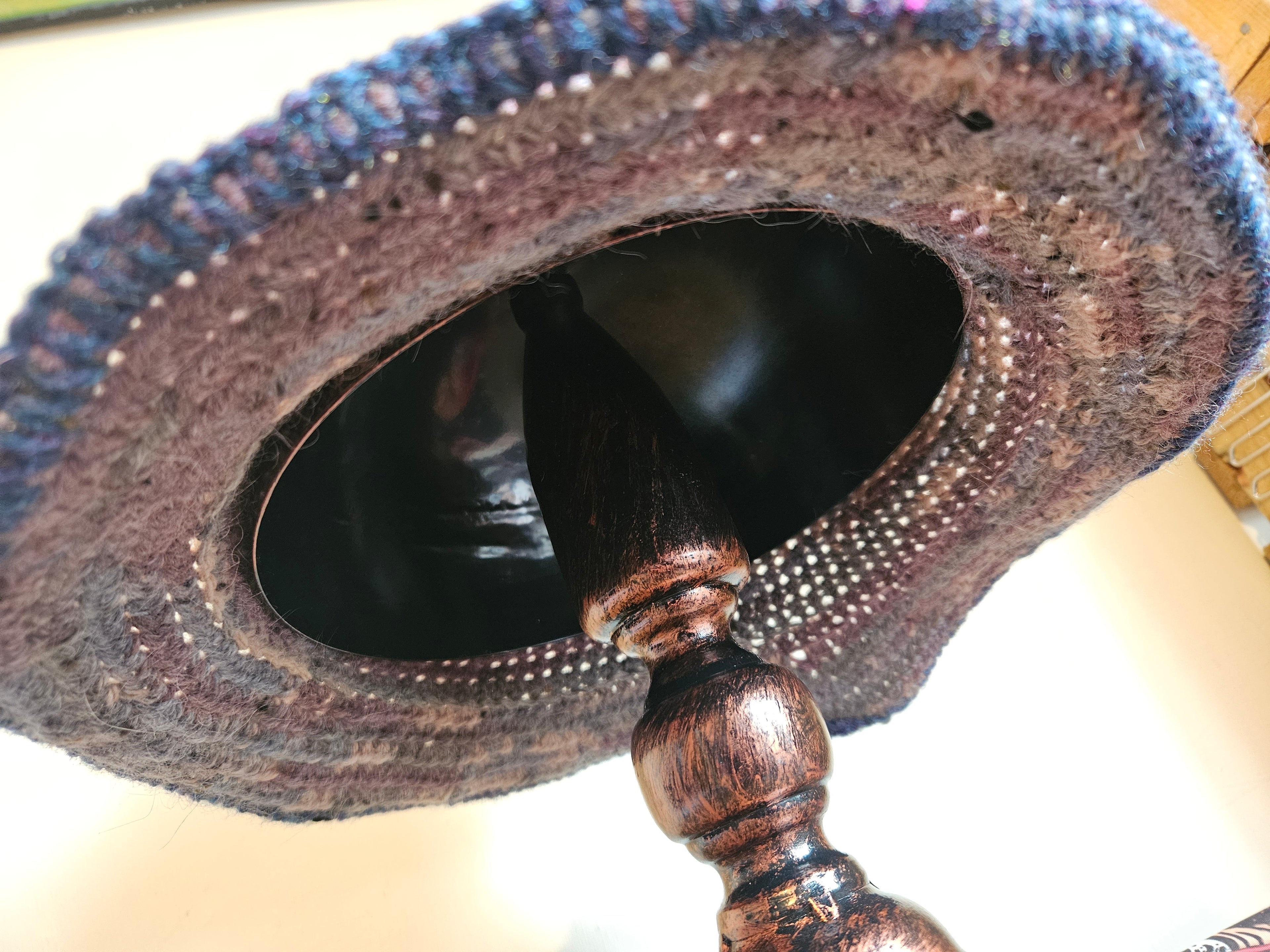 Bottom view of hat on a stand