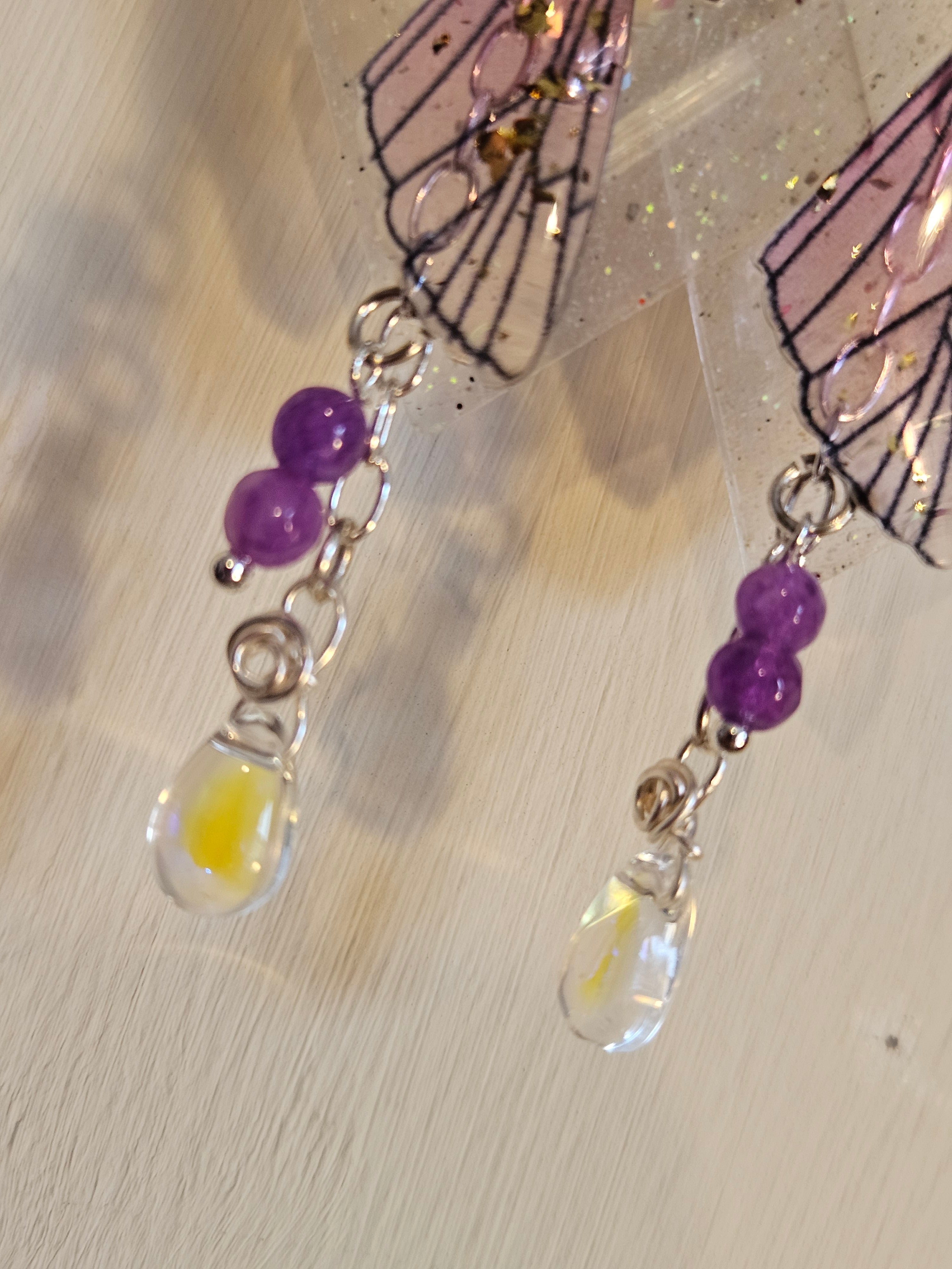 Close up of fairy earrings with glass droplets