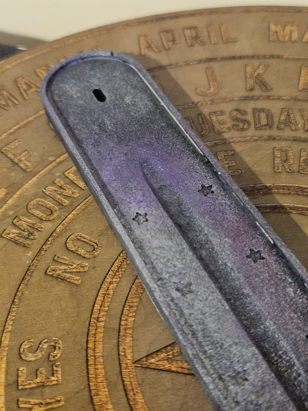 Close up of purple & silver ash catcher