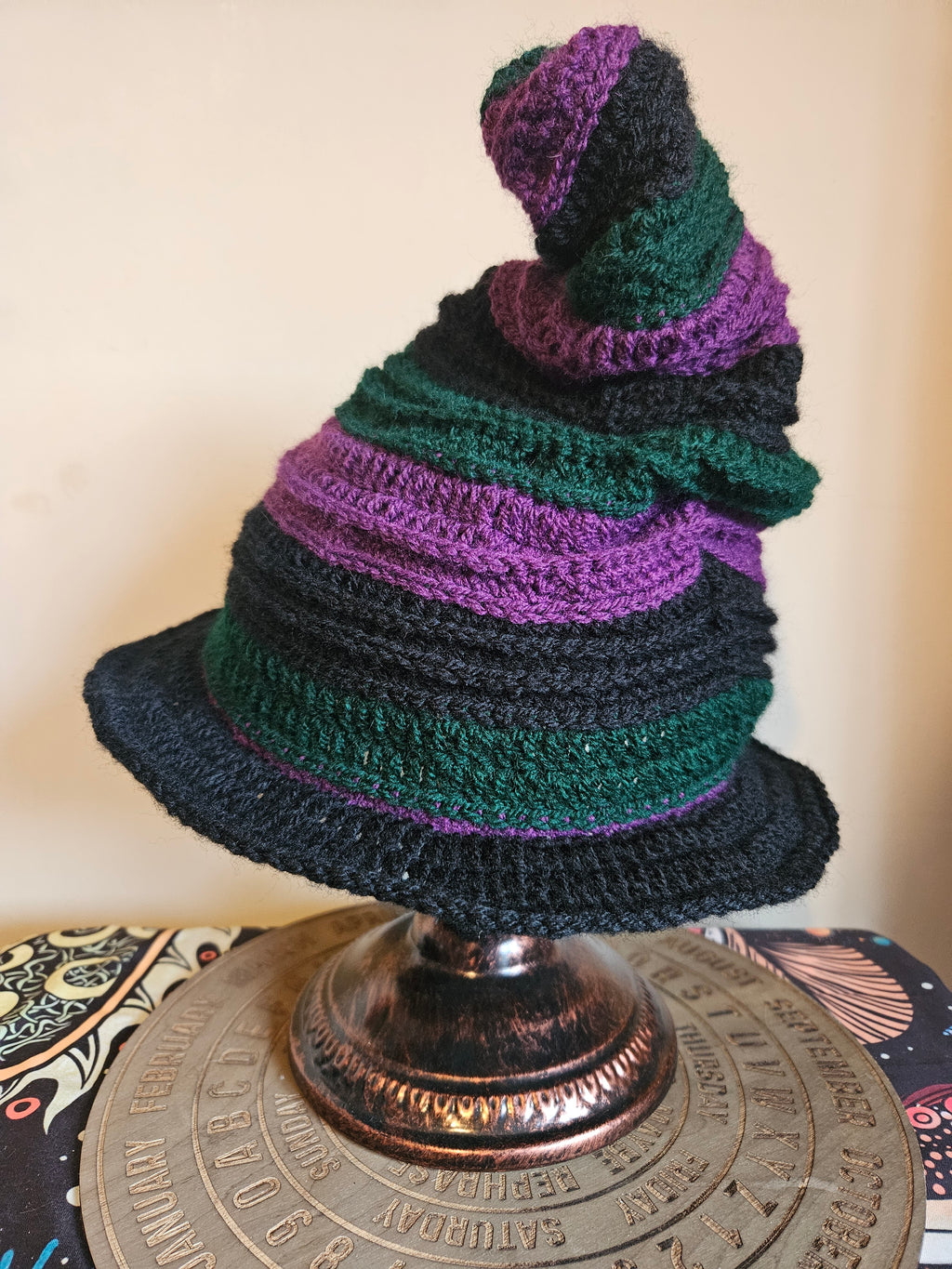 Crocheted witch hat on a stand