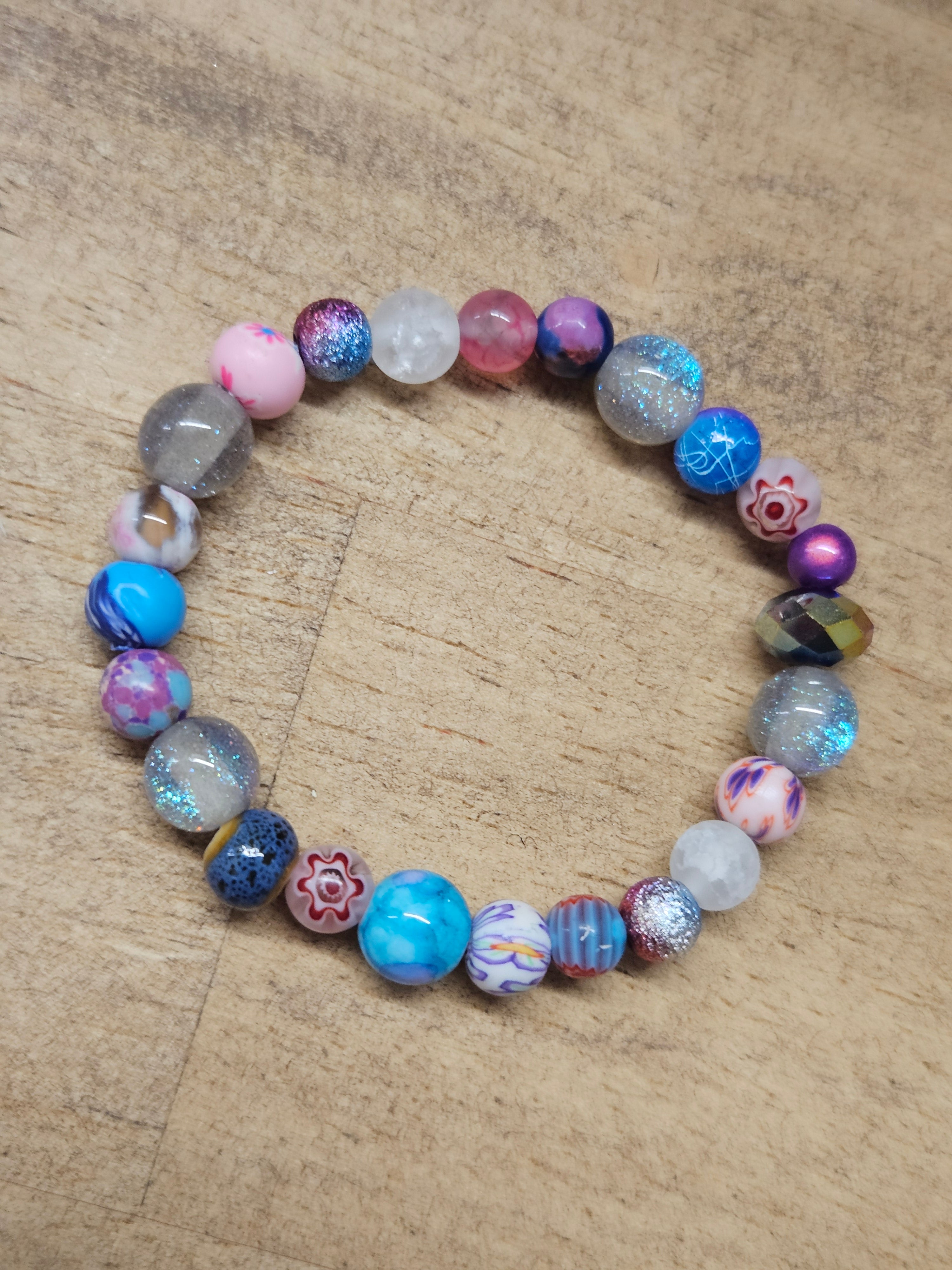 Multicolored beaded bracelet on a wooden surface