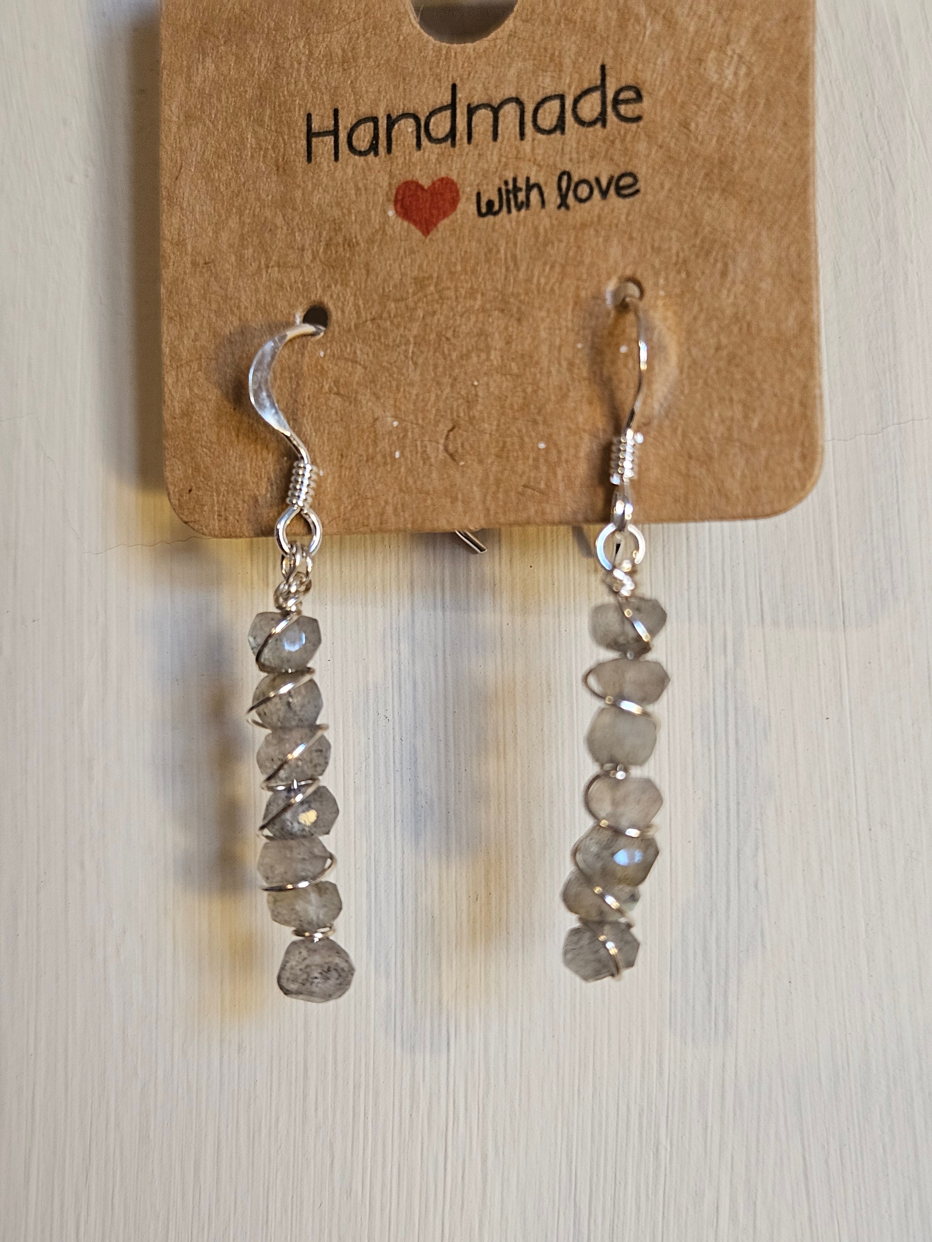 Silver beaded earrings on a cardboard tag with 'Handmade with Love' text.