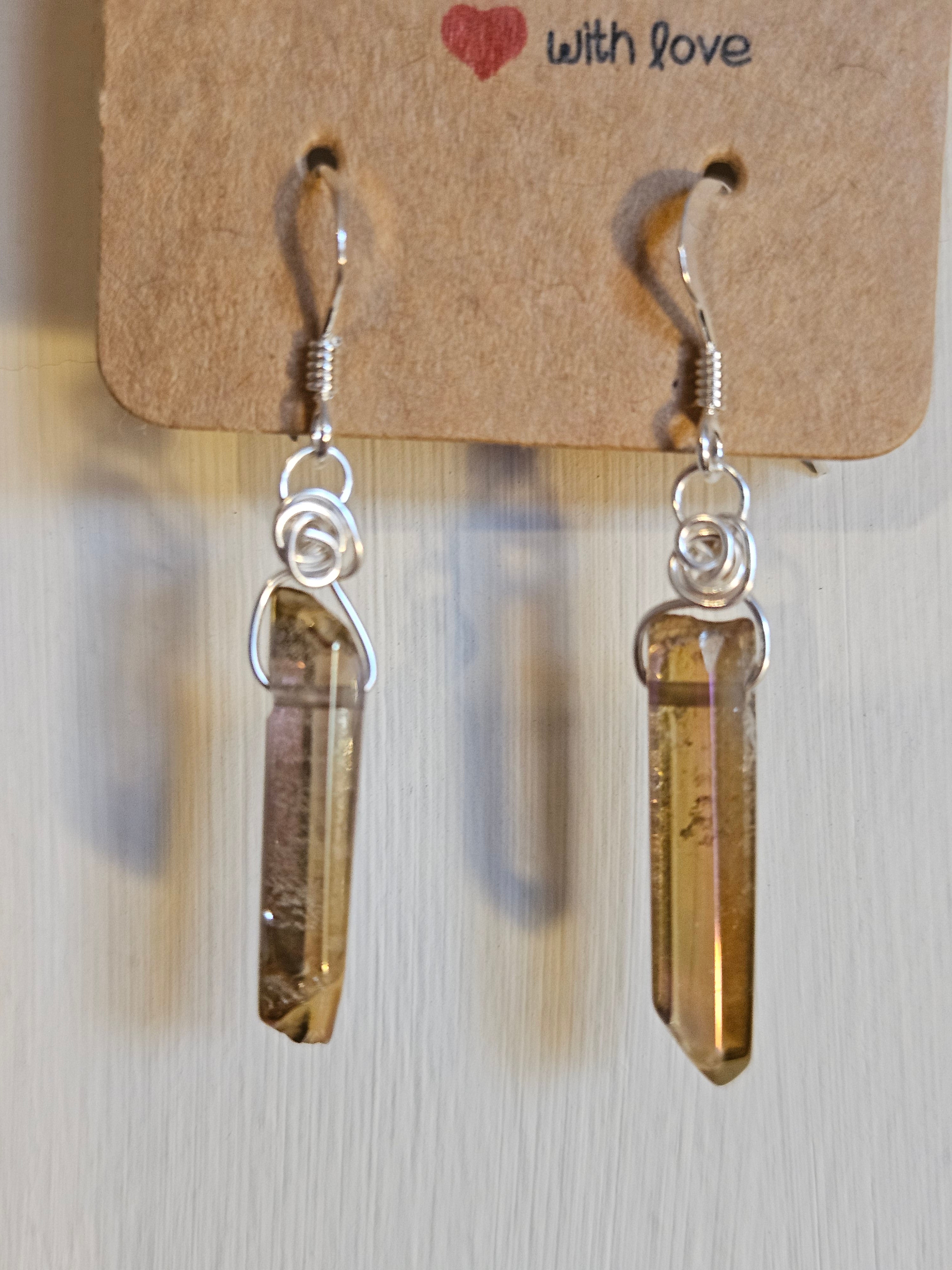 Crystal earrings on a cardboard tag with 'with love' text.