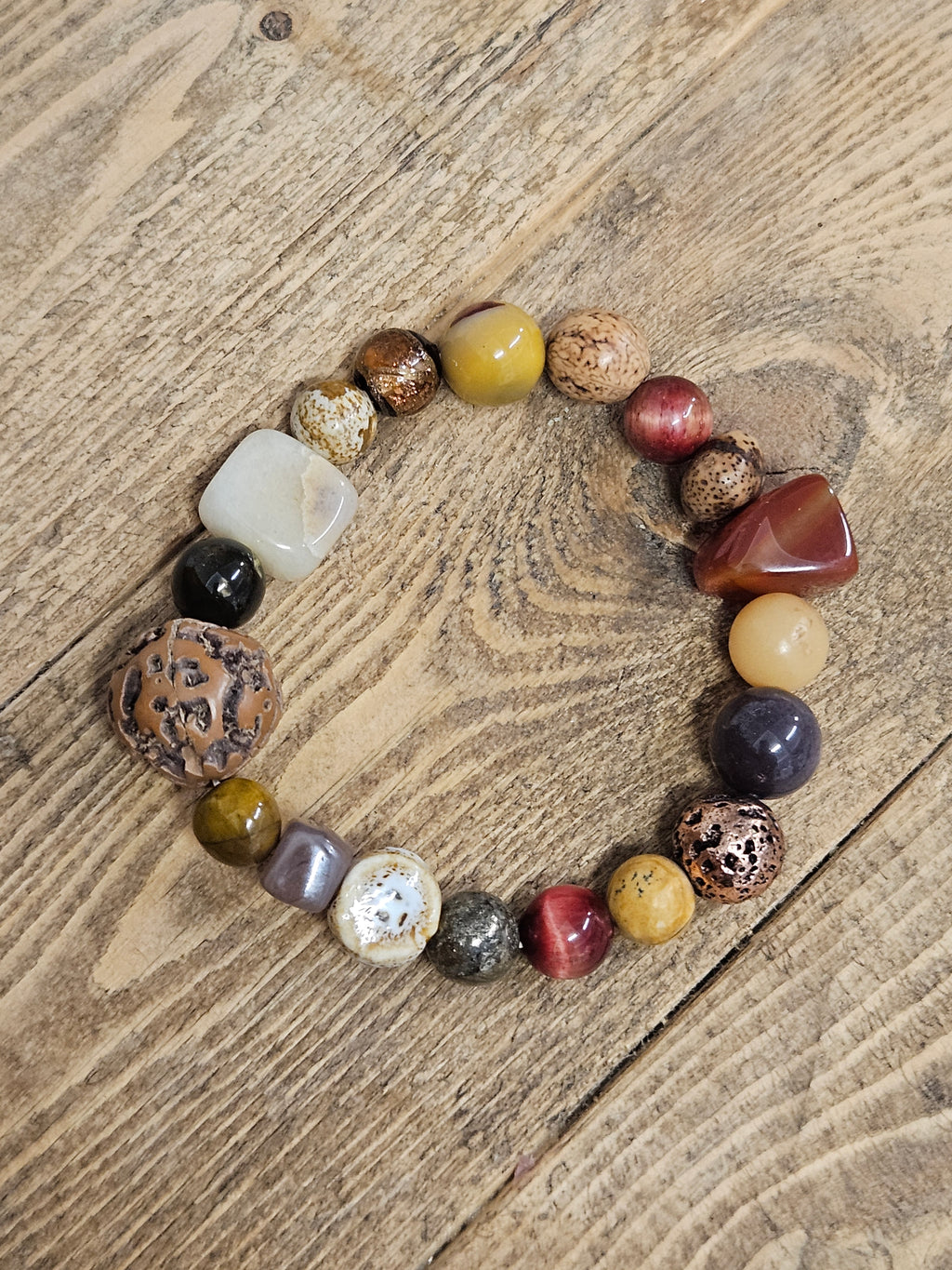 Beaded bracelet with natural beads on a wooden background