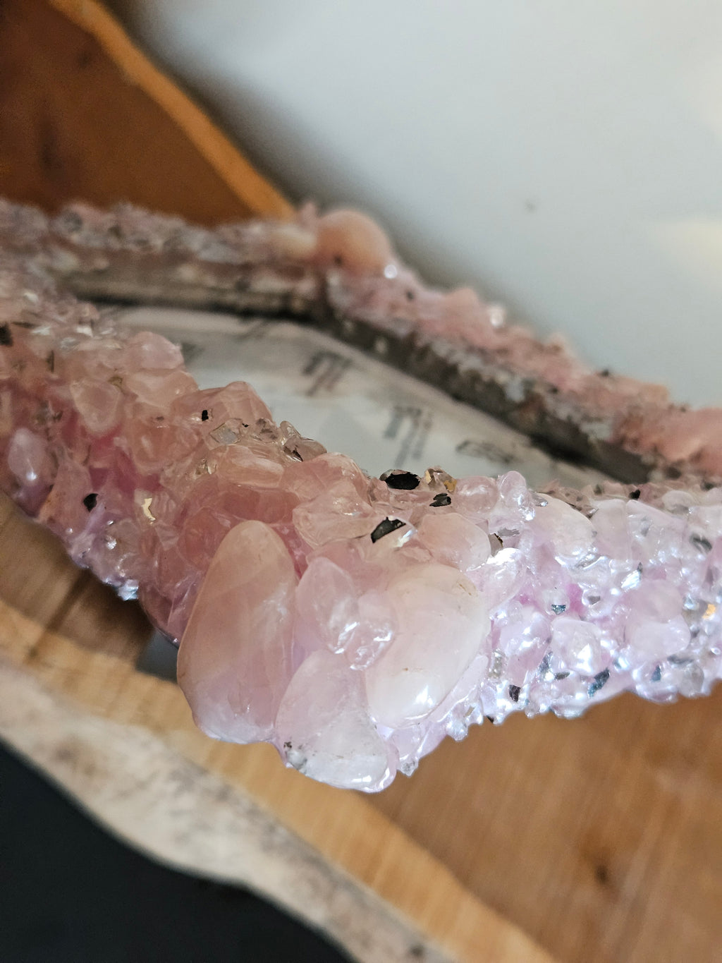Close-up of a pink Rose Quartz crystal photo frame top view