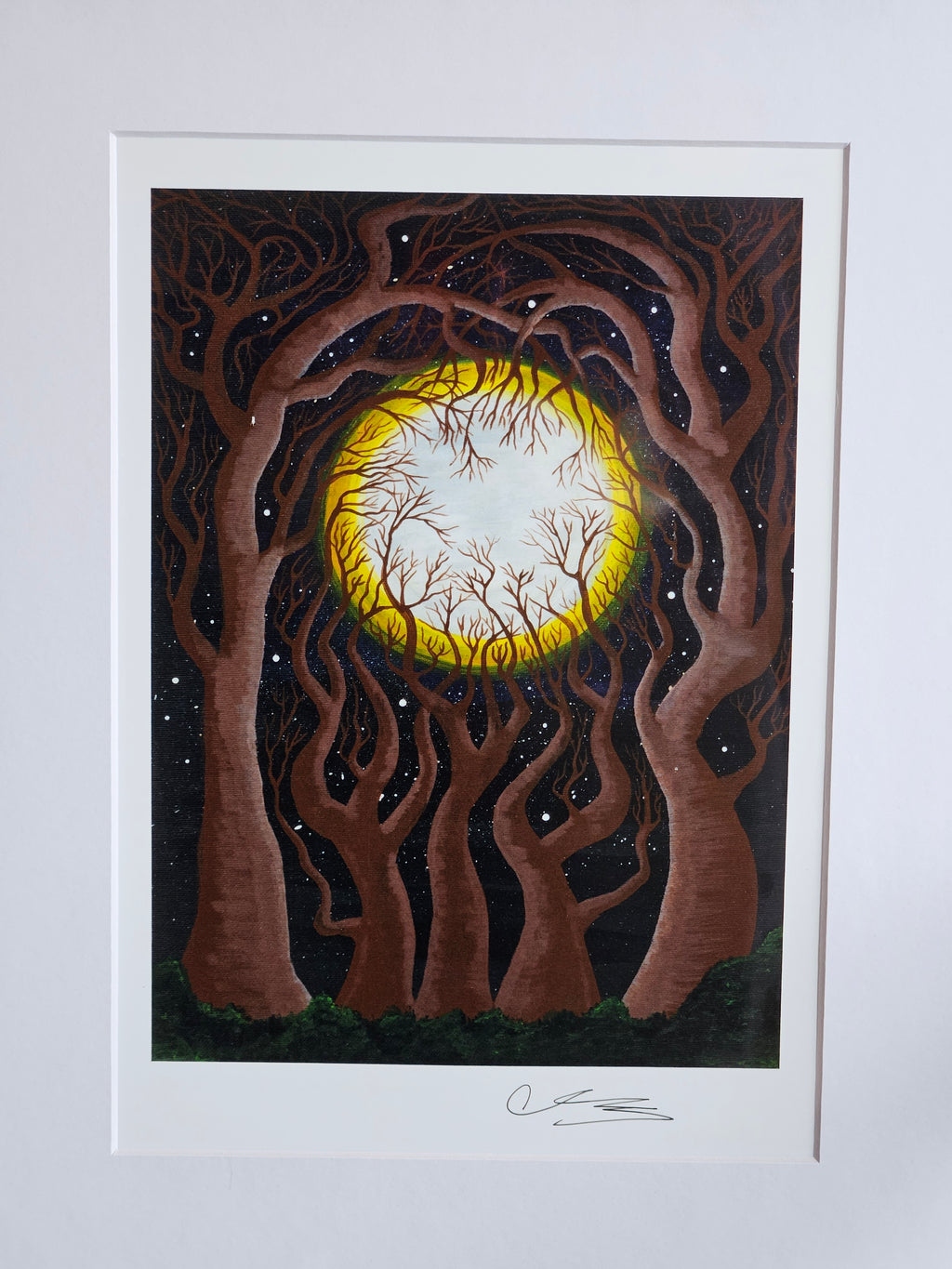 Twisted brown trees around a yellow and white moon.