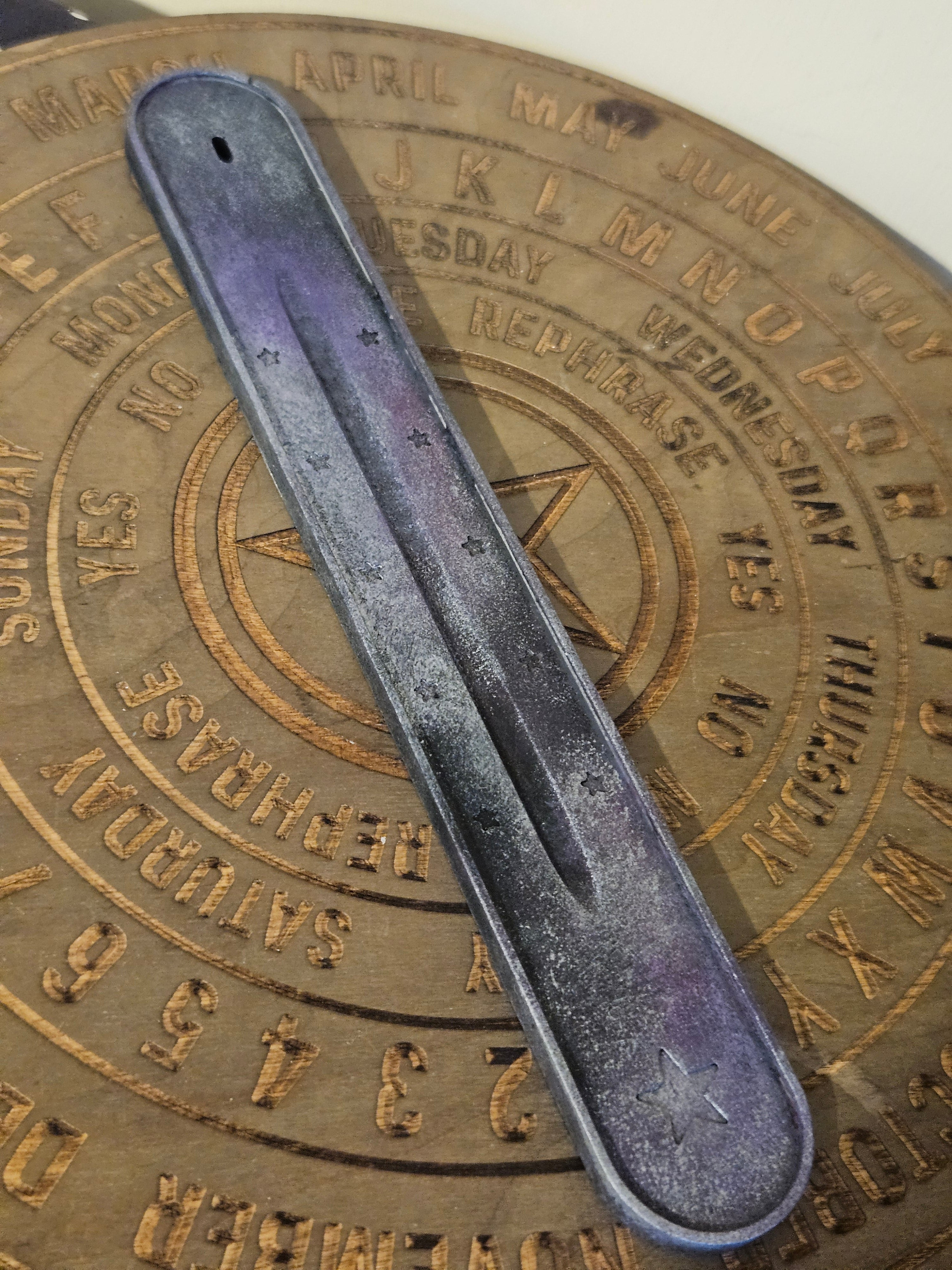Purple, Black & Silver ash catcher on a wooden board