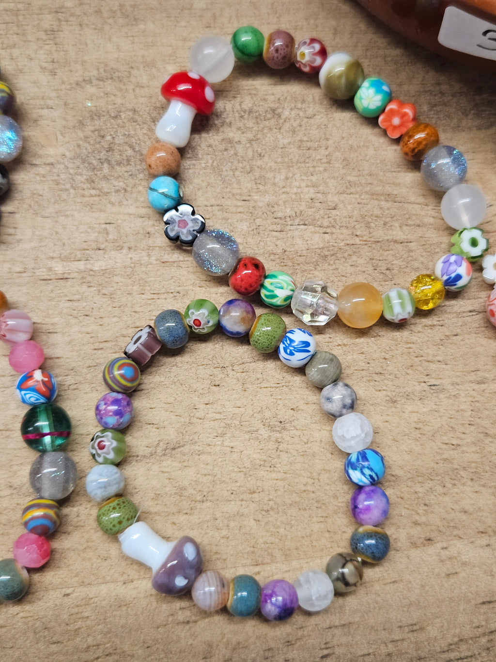 Colorful beaded bracelet on a textured surface