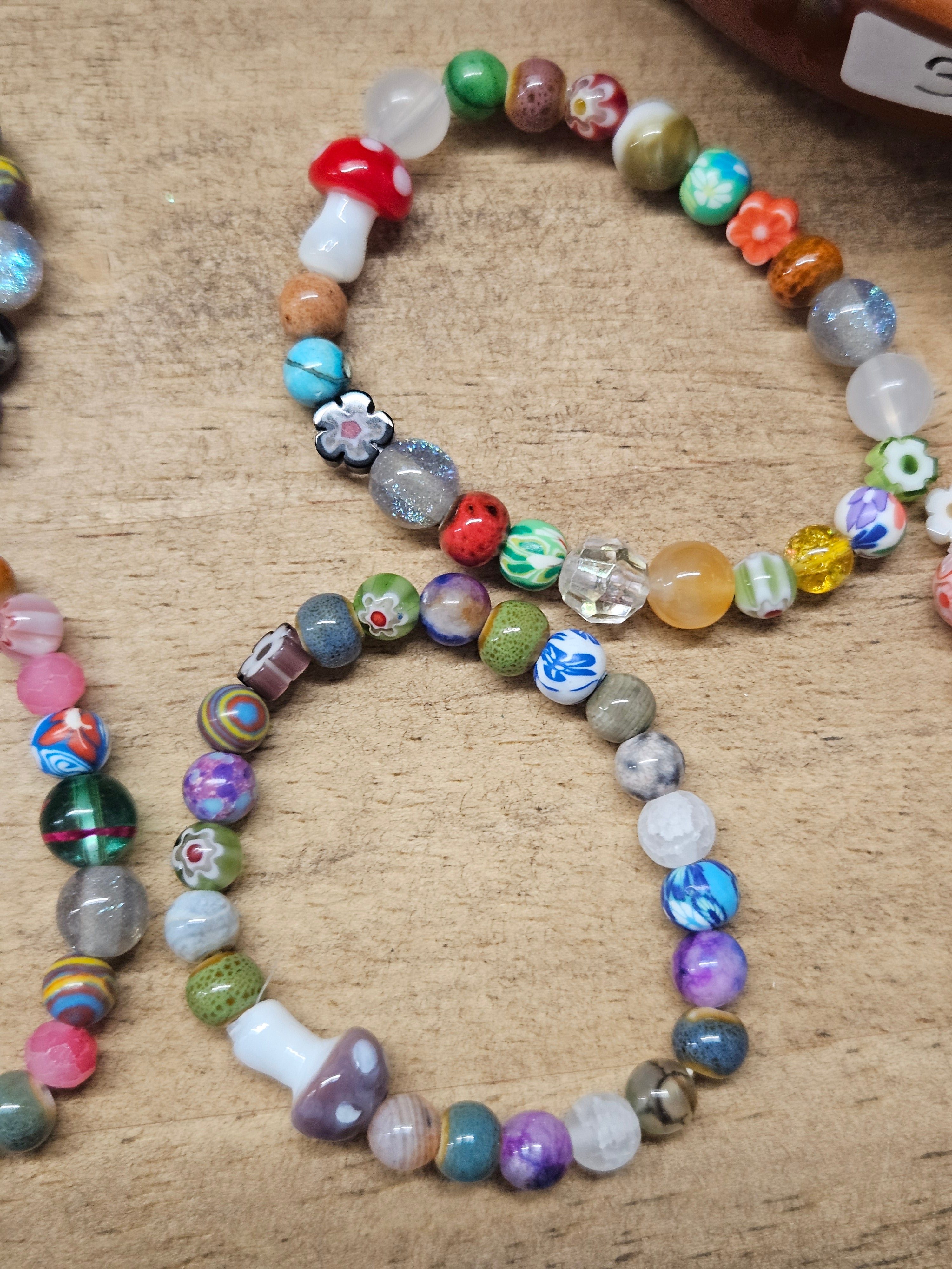 Colorful beaded bracelet on a textured surface