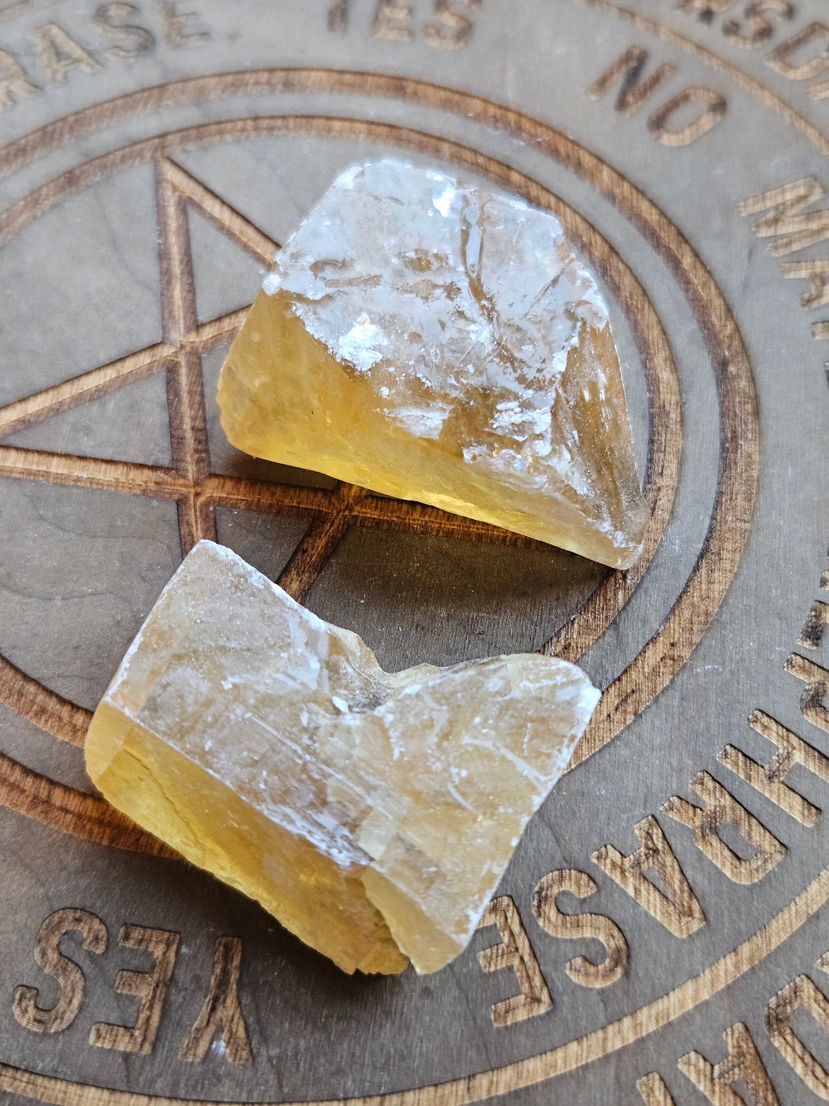 Yellow Citrine chunks on a wooden board
