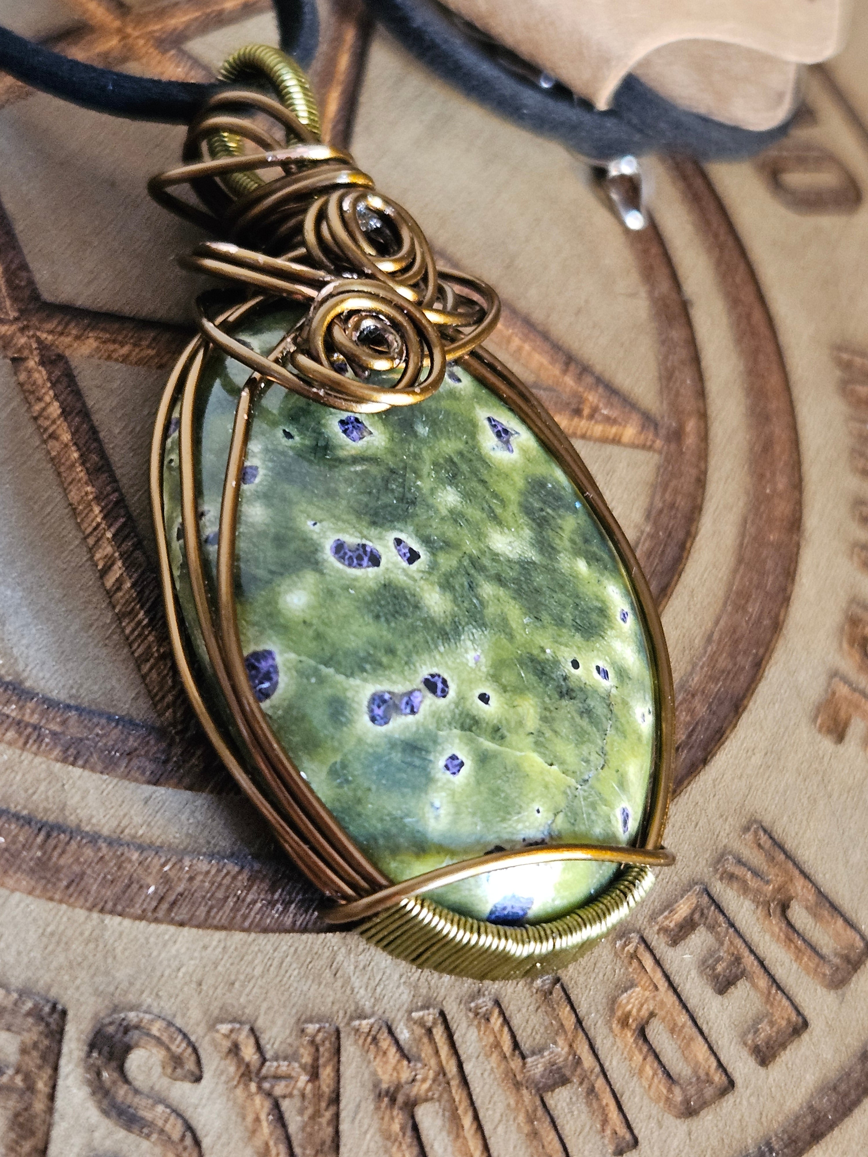 Side view of Atlantasite pendant