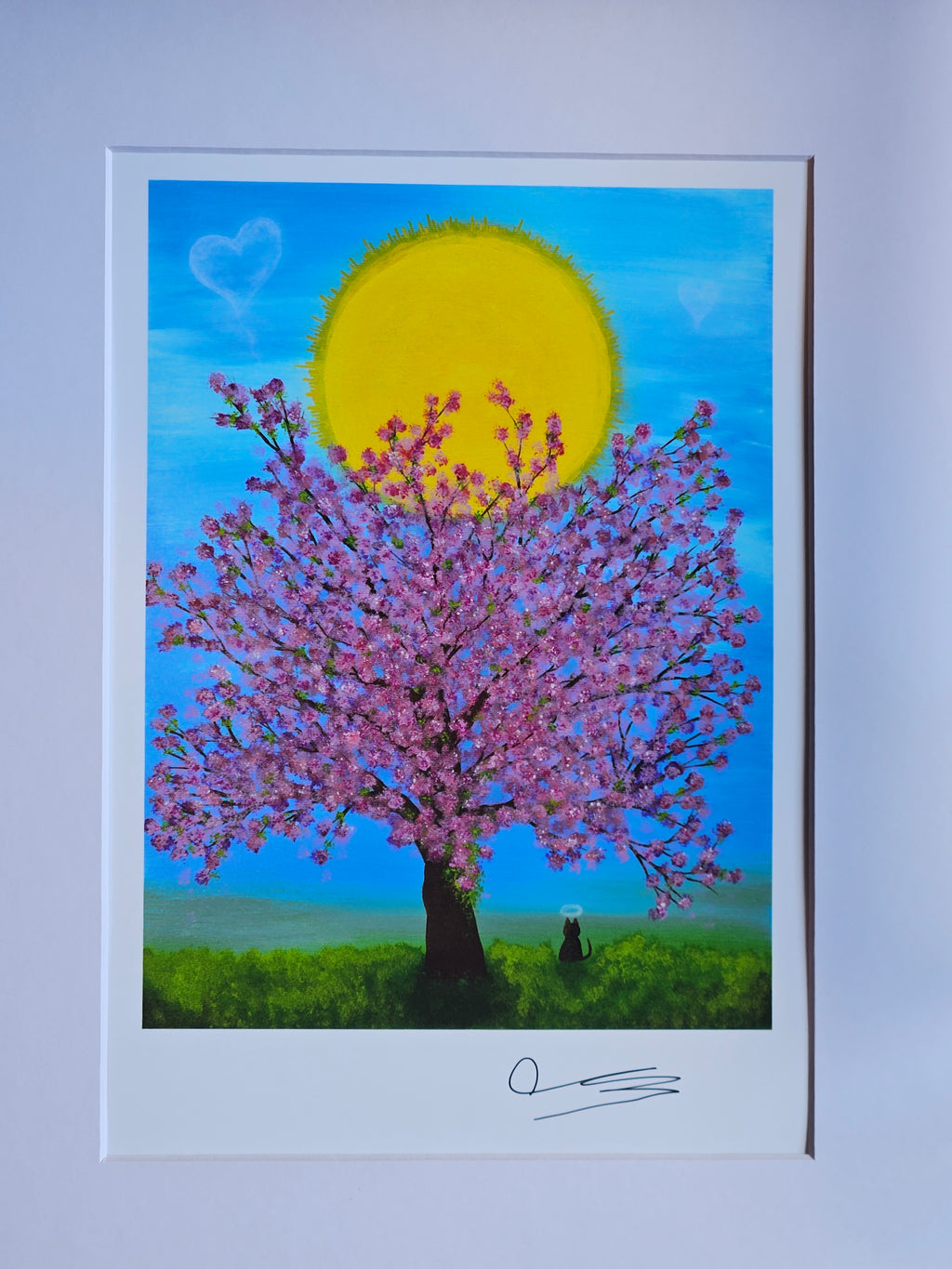 Framed artwork of a cherry blossom tree with a yellow sun and blue sky.
