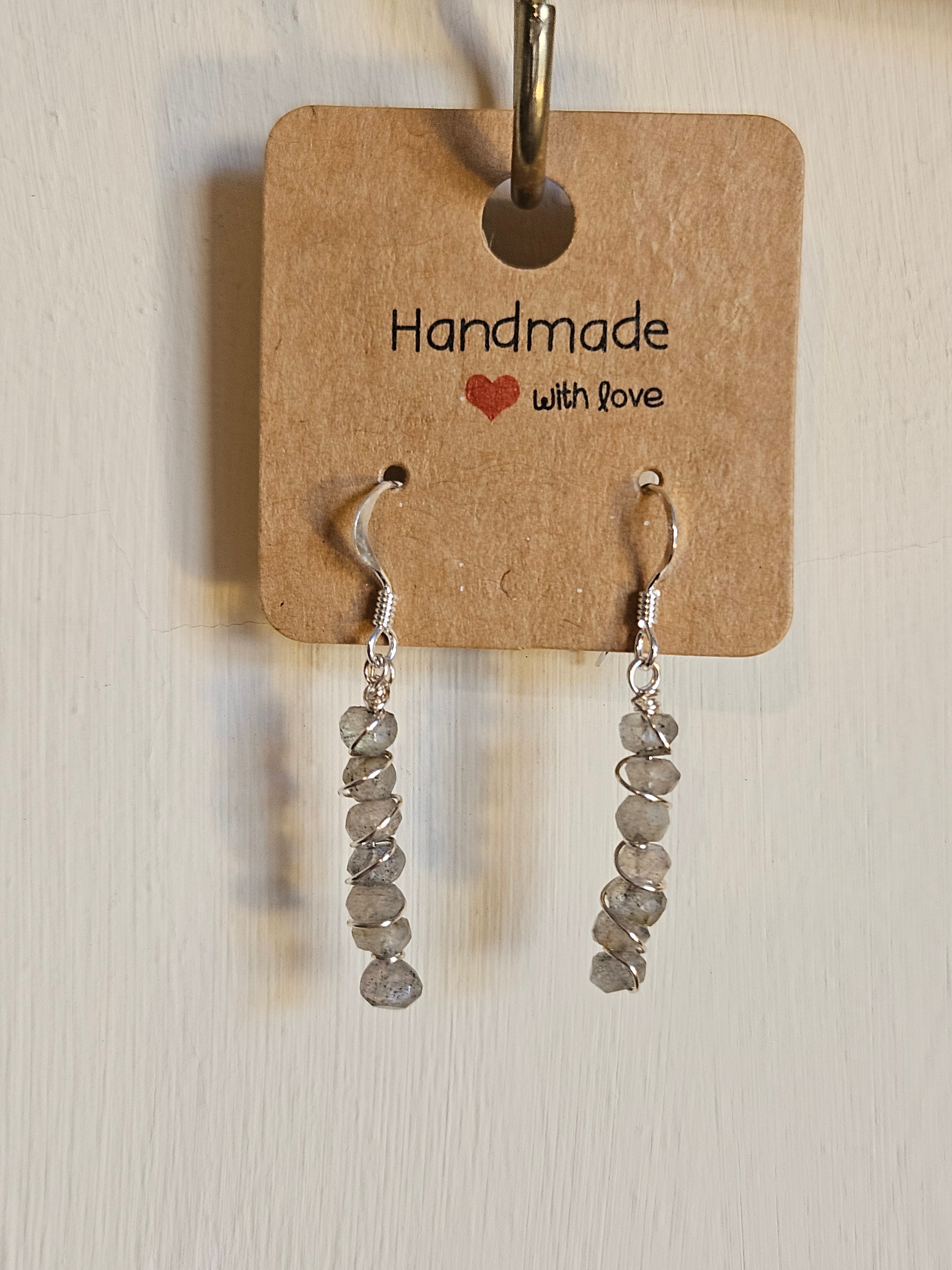 Pair of silver beaded earrings on a 'Handmade with Love' card.