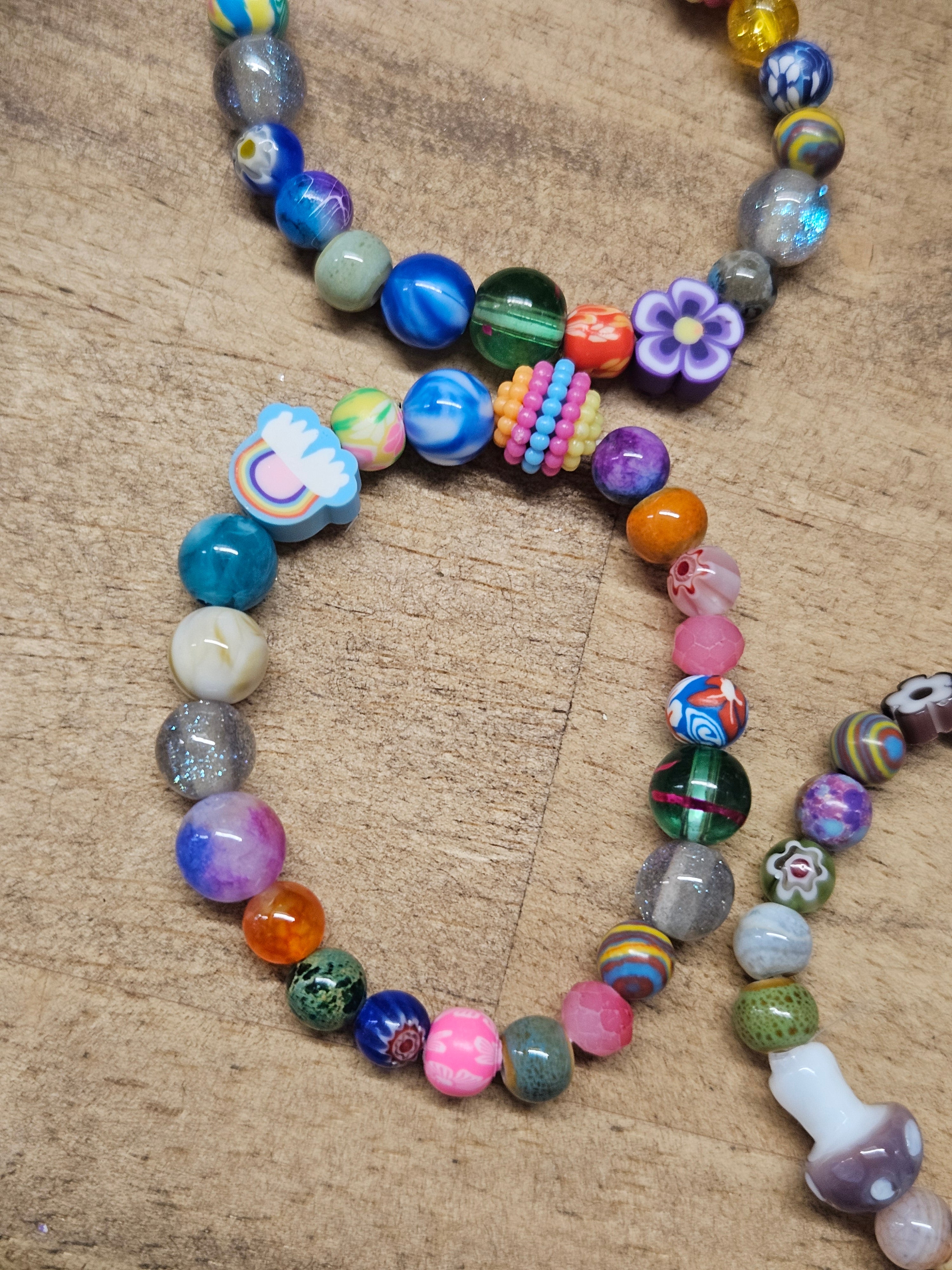Colorful beaded bracelet on a wooden surface