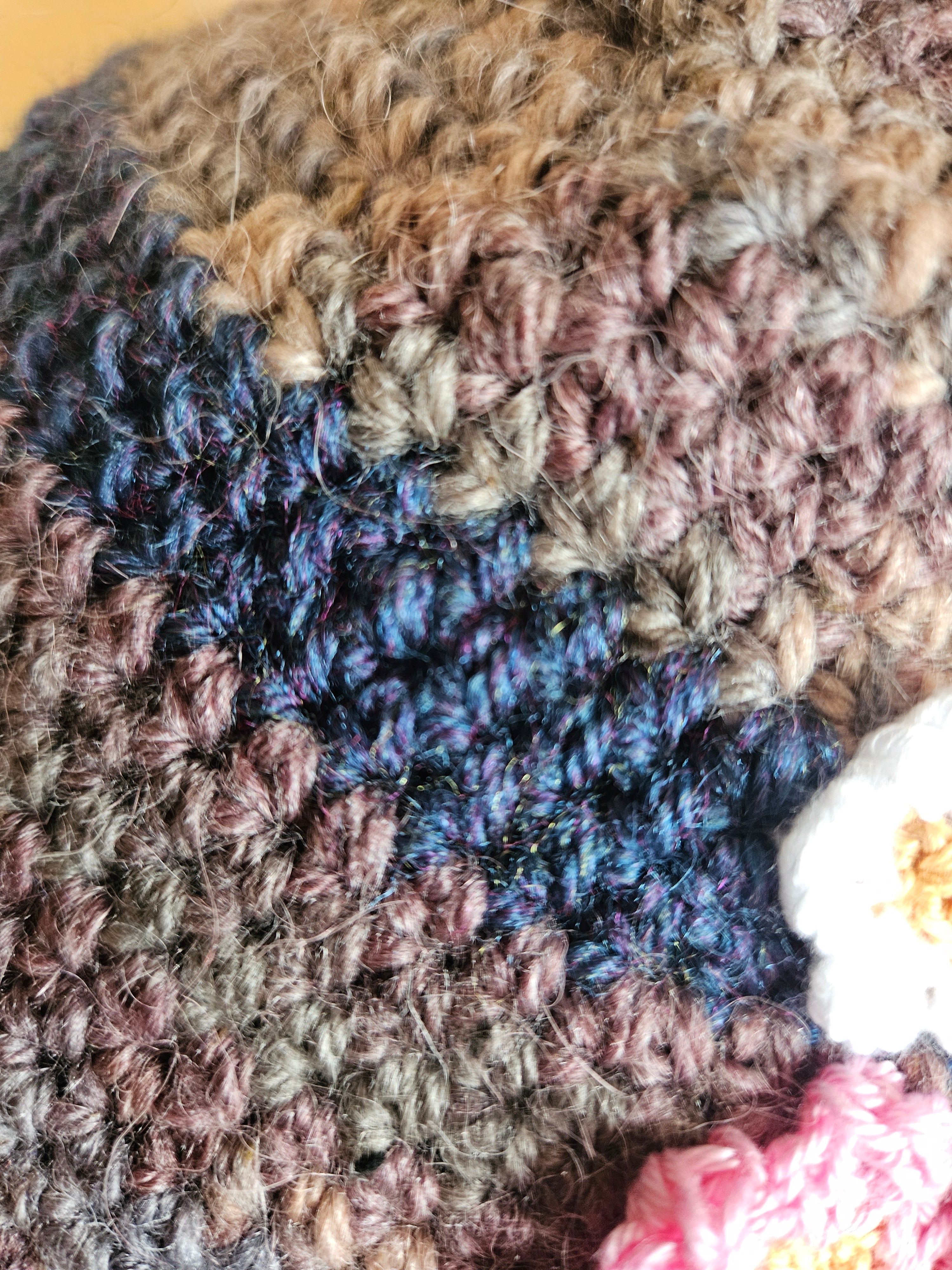 Close-up of a textured fabric with multicolored yarn patterns